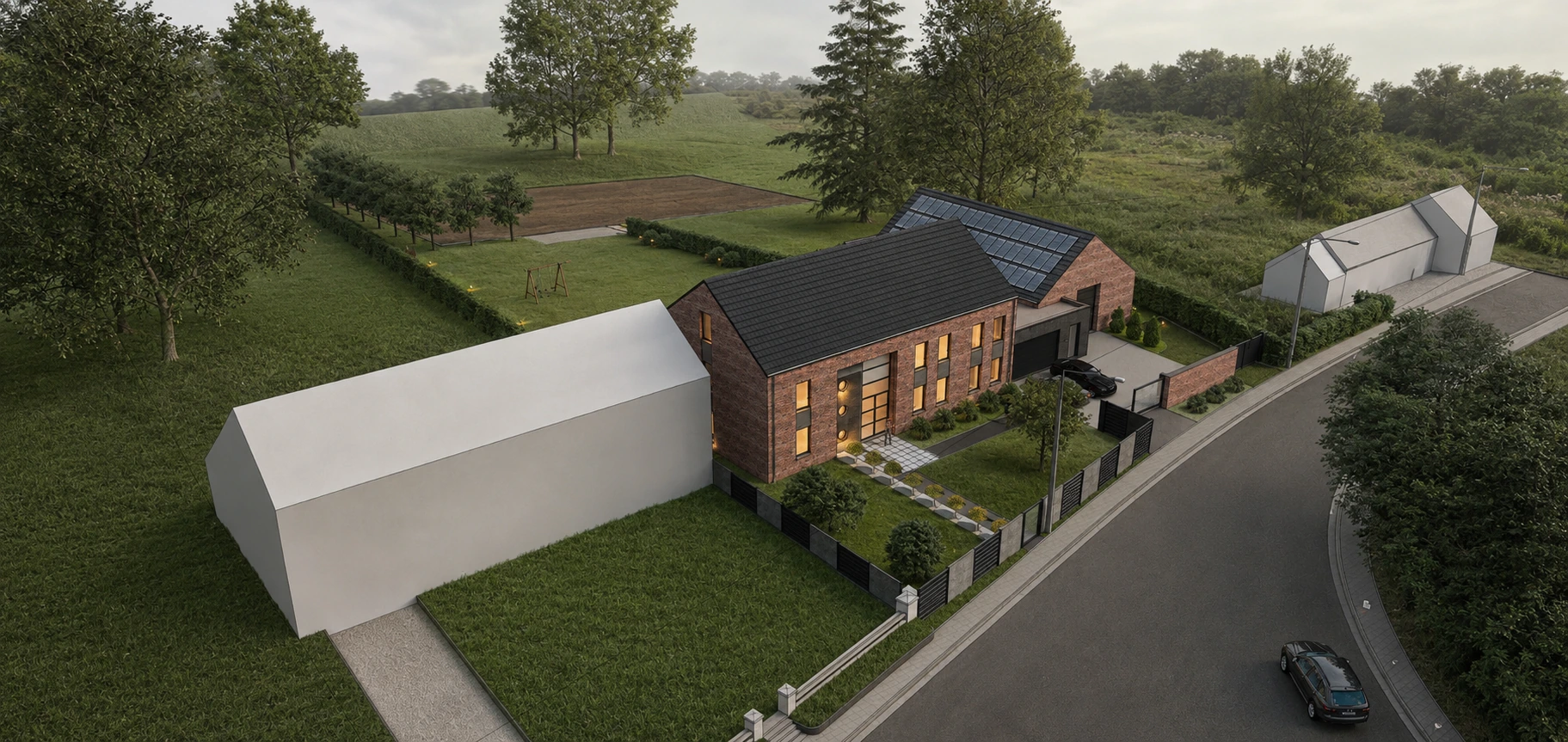 Vue aérienne au crépuscule d'une habitation en briques rouges à toiture noire, avec panneaux solaires et jardin