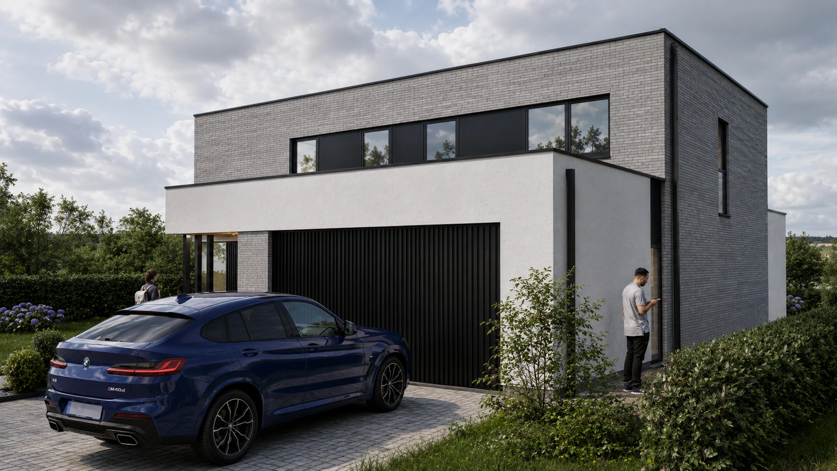 Vue depuis l'accès carrossable sur le garage et le volume enduit clair