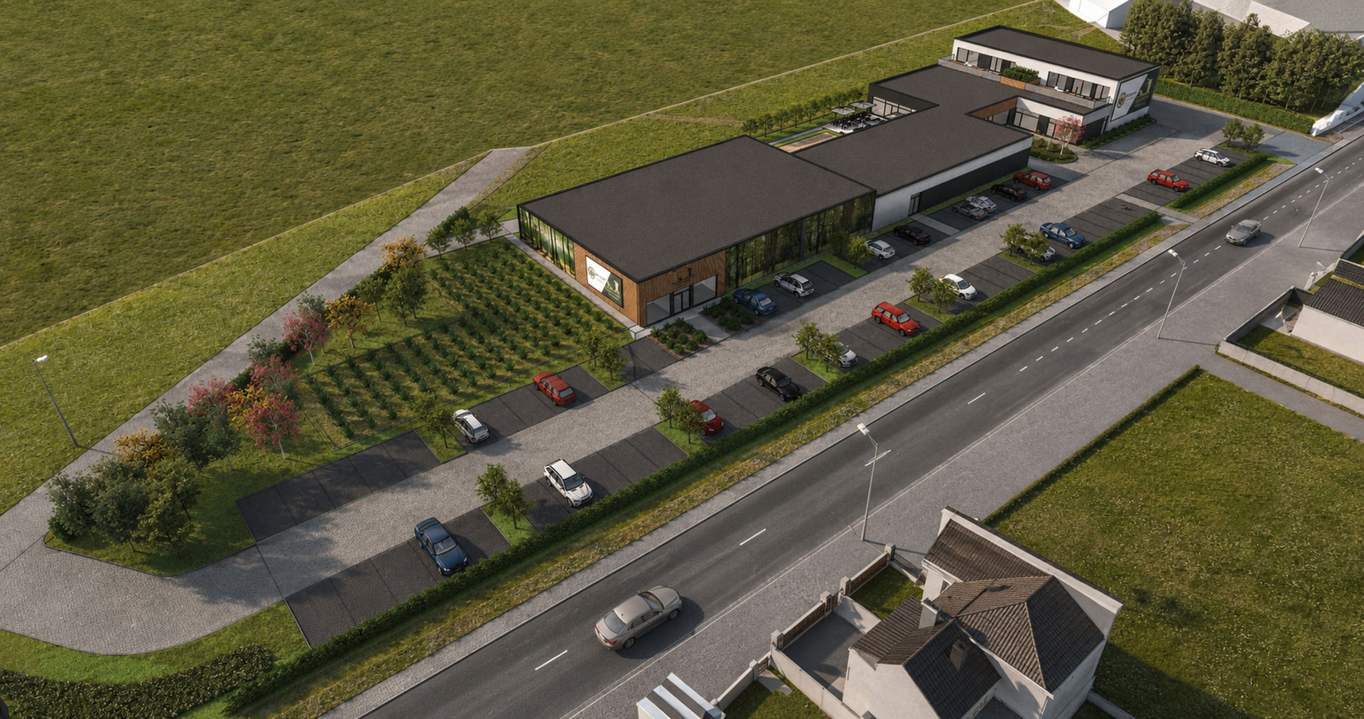 Vue aérienne du site, du parking planté et des vergers