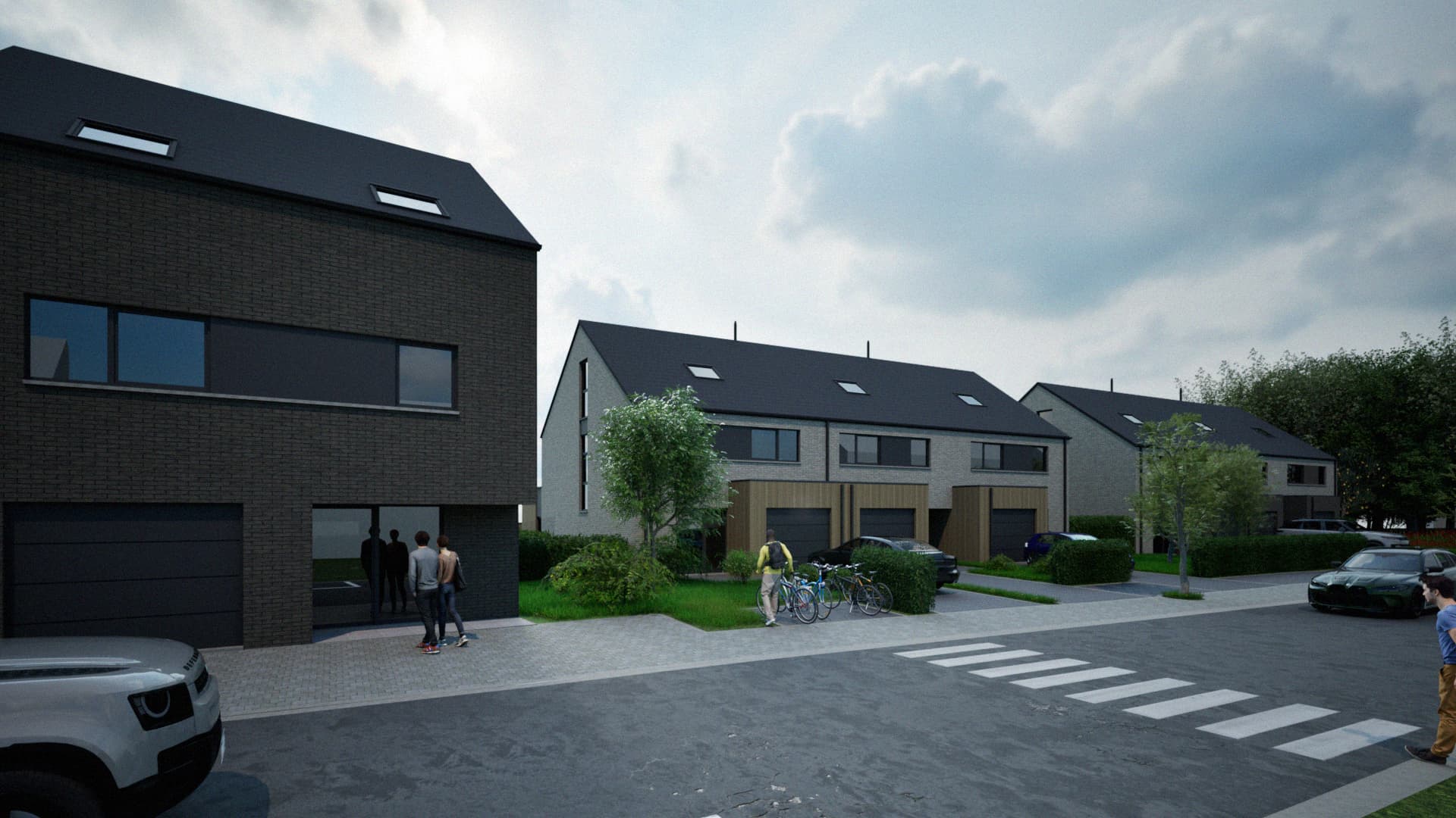 Vue de jour depuis la rue de l'ensemble de logements et de leurs garages