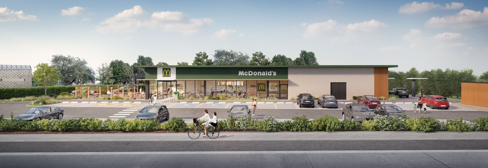 Élévation frontale du restaurant depuis la voirie avec son parking planté