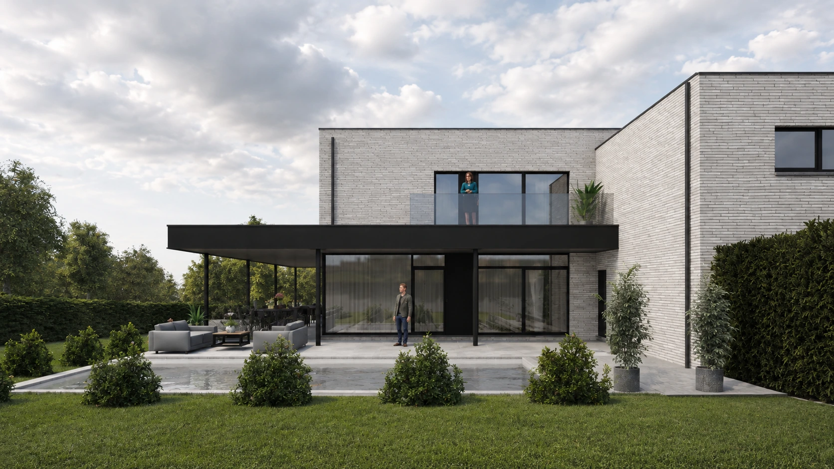 Vue frontale de la façade jardin avec balcon et grandes baies vitrées